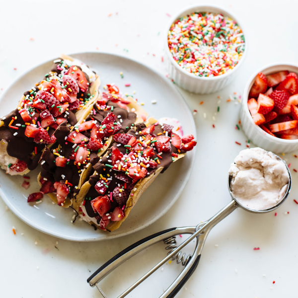 choco tacos topped with strawberries and sprinkles