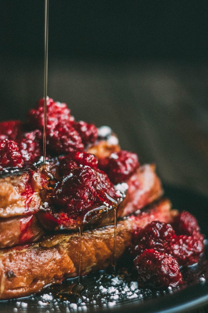 syrup pouring over blackberry french toast