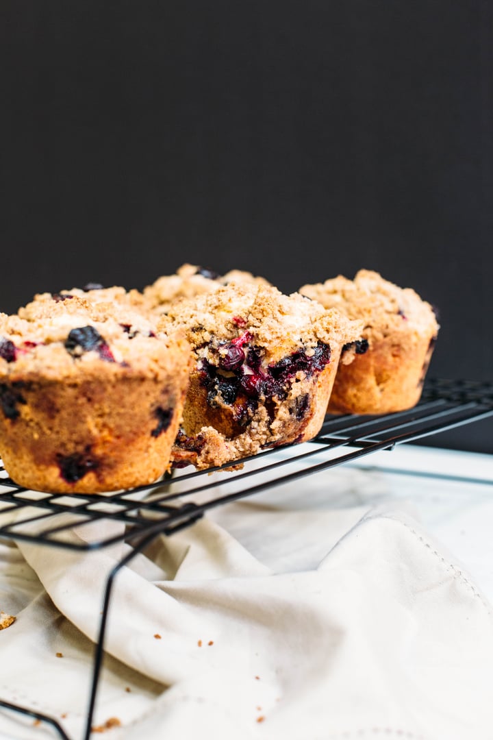 blueberry coffee cake muffins on a cooling rack
