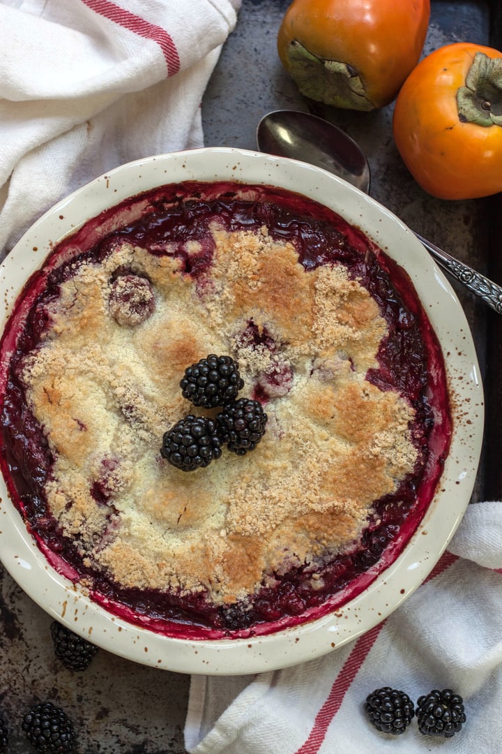 berry cobbler topped with blackberries