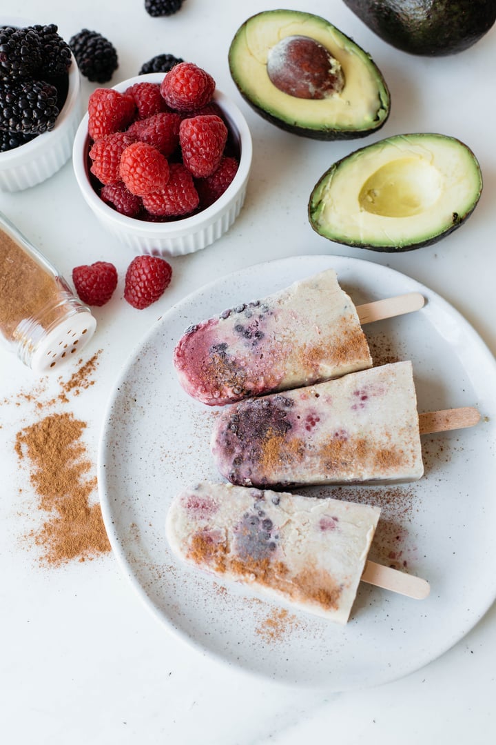 Berry horchata popsicles sprinkled with cinnamon