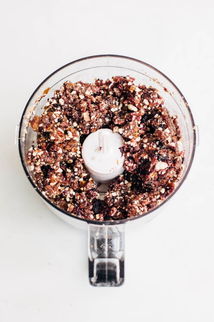 dried blueberries, cashews, pecans, and dates combined in a food processor
