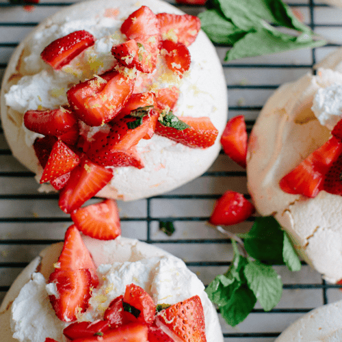 pavlovas topped with strawberries