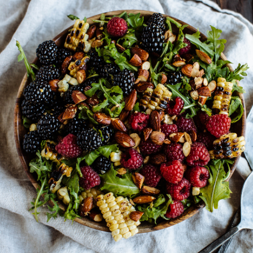 chipotle corn salad topped with berries