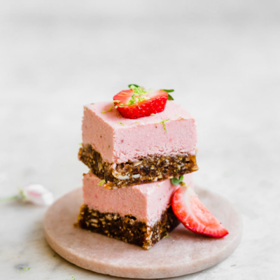 strawberry key lime pie bars stacked on top of each other