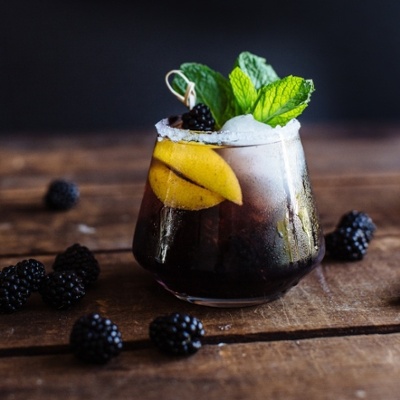 blackberry bourbon cider topped with mint leaves