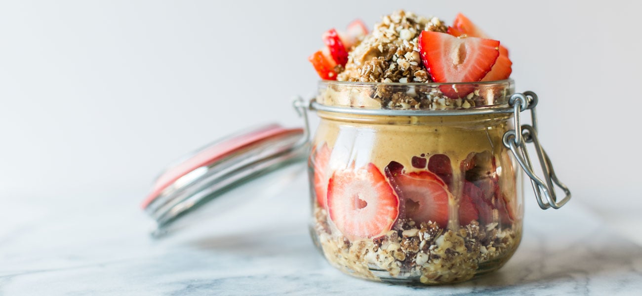 peanut butter and berry parfait in a jar