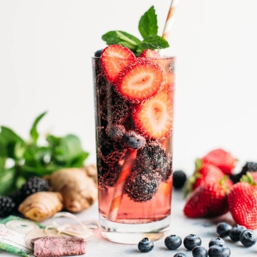 cocktail or mocktail with berries inside the glass