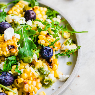 salad with grilled corn, blueberries, and goat cheese
