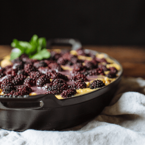 White Chocolate bread pudding topped with blackberries