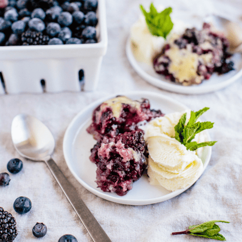 Blueberry and blackberry cobbler with a side of ice cream 
