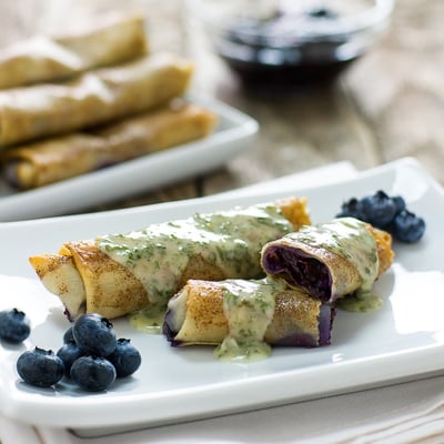 blueberry pie roll-ups on a plate 