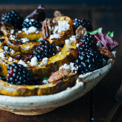 blackberries with squash and goat cheese in a bowl