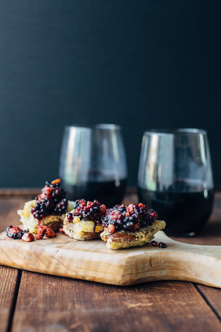 artichokes with blackberry pesto on a wooden board
