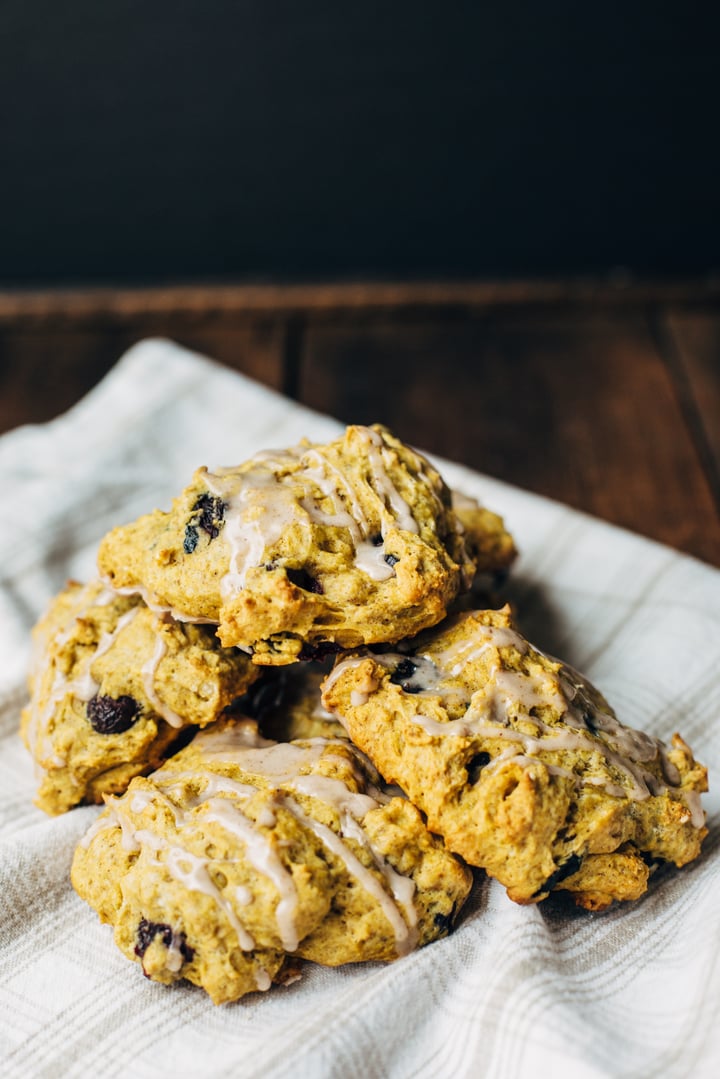 blueberry pumpkin scone drizzled with a blueberry glaze