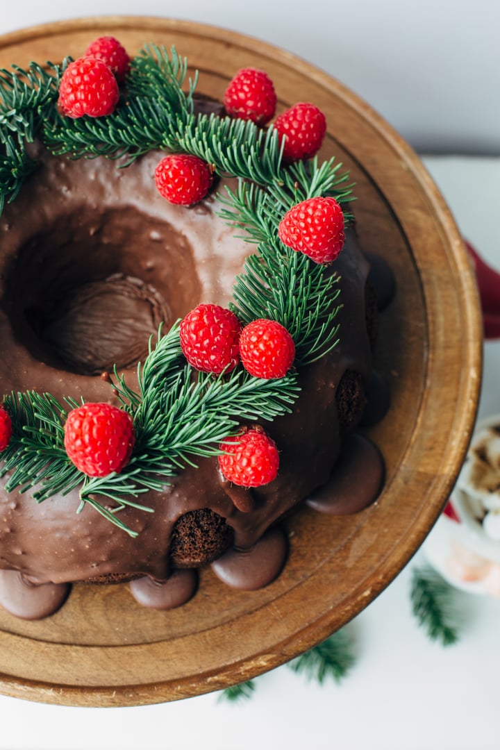 chocolate bundt cake topped with raspberries