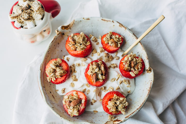 yogurt topped with granola stuffed strawberries 