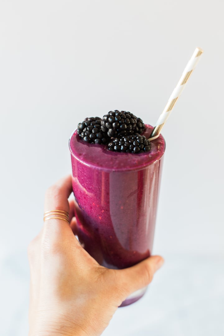 beet smoothie topped with blackberries
