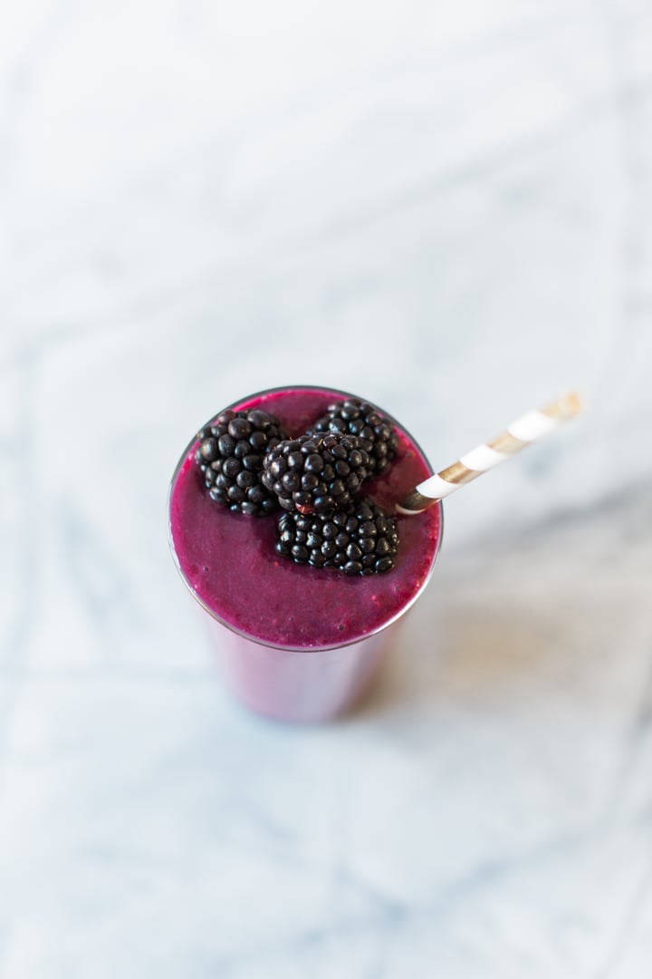 beet smoothie topped with blackberries