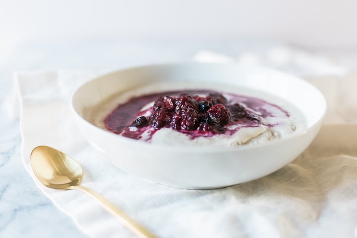 porridge topped with berry sauce