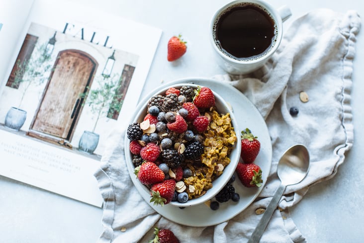 golden oatmeal topped with berries