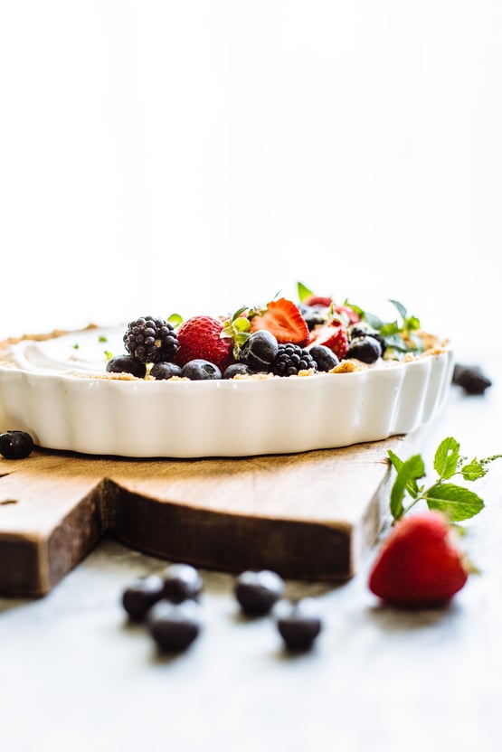 greek yogurt berry tart on a cutting board