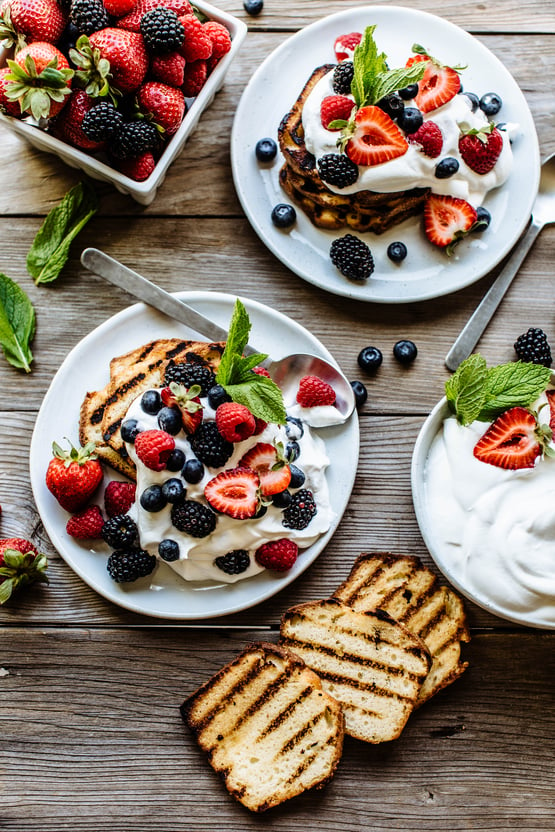 grilled pound cake topped with berries and whipped cream 