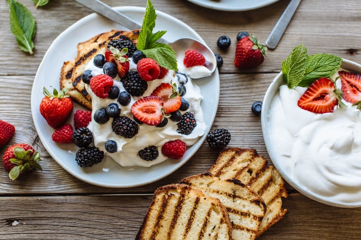 grilled pound cake topped with berries and whipped cream 