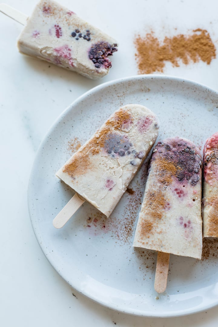 Berry horchata popsicles sprinkled with cinnamon