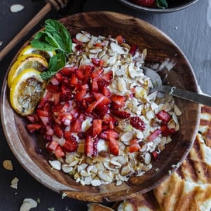 yogurt with strawberry, coconut, lemon, and toasted almonds