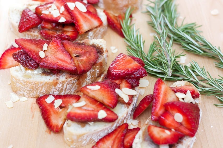 strawberry sandwich topoed with brie cheese and strawberries