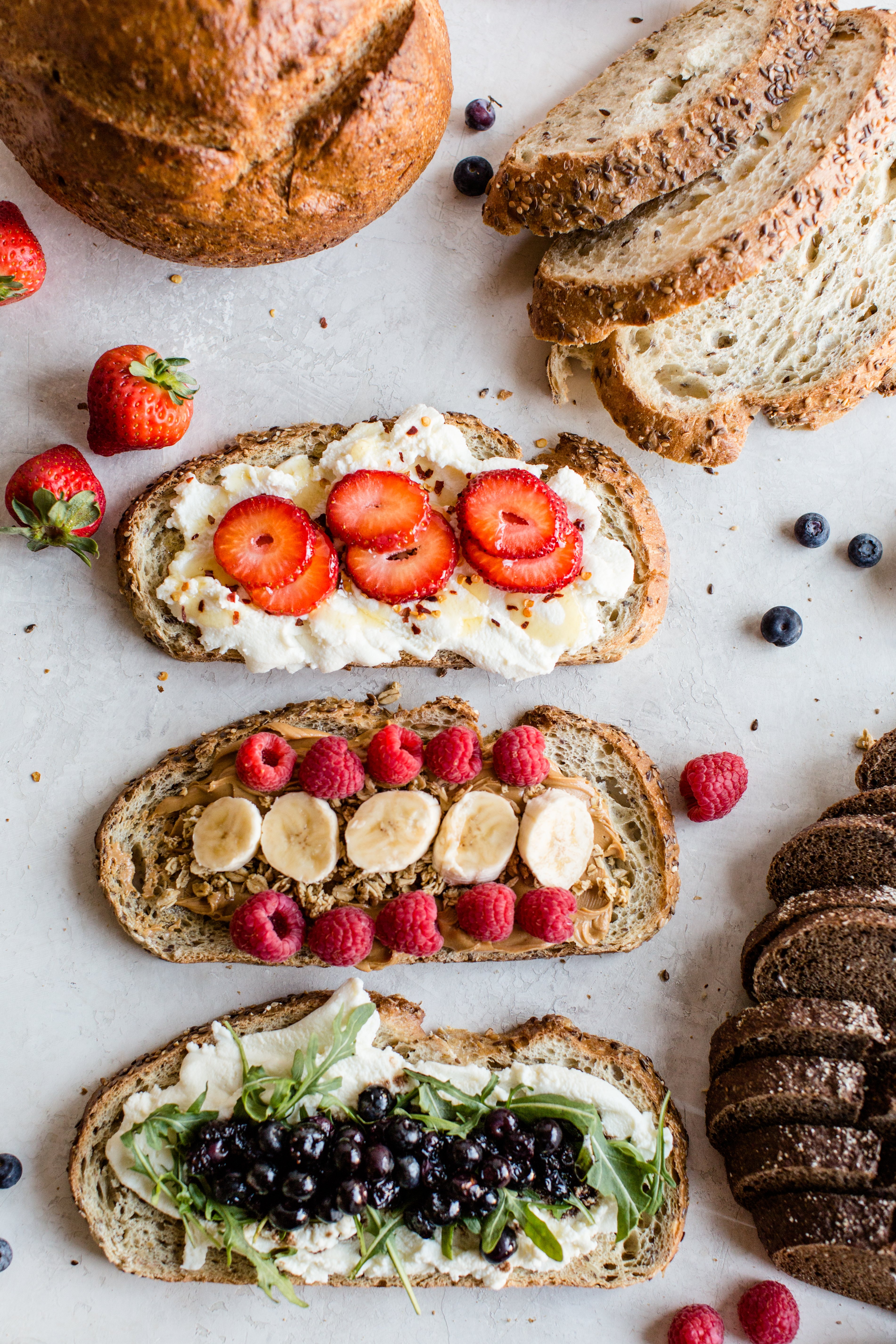 three different types of toast. All three are topped with berries