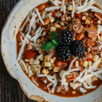 beef chili topped with blackberries
