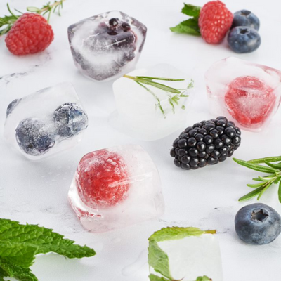 ice cubes with berries frozen into them