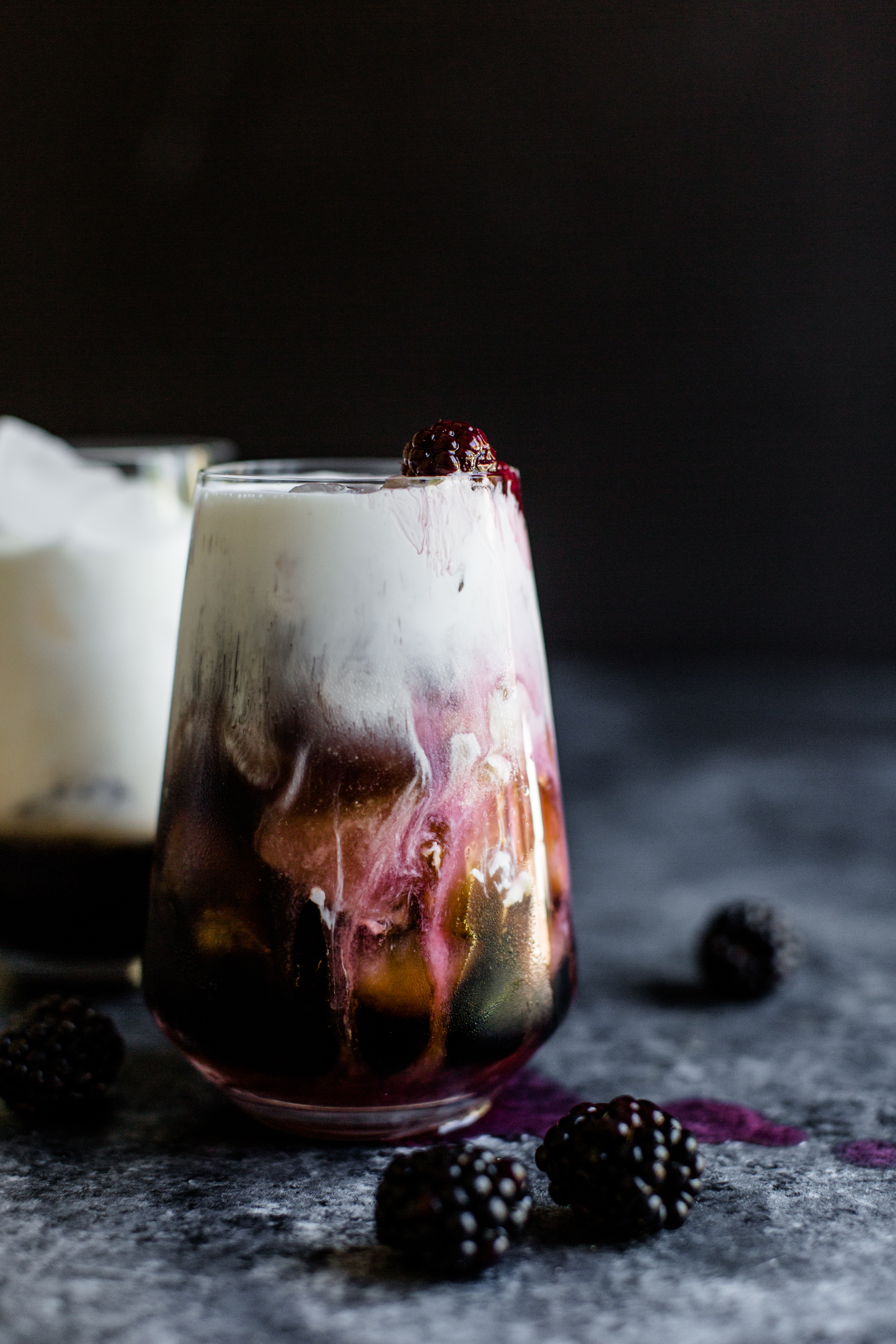 a white russian cocktail that has blackberries in it
